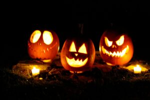 jack o lantern on brown dried leaves